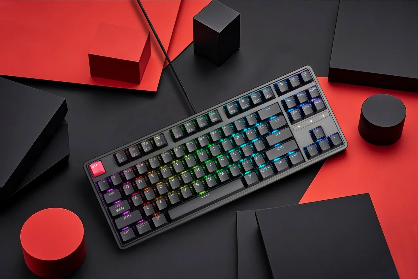 Keychron C3 Pro 8K tenkeyless keyboard with illuminated keys on a black and red desk
